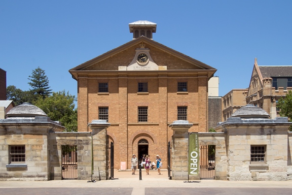 Hyde Park Barracks Museum, Sydney, Australia SYDNEY, AUSTRALIA-December 19th 2913: Tourists leaving the Hyde Park Barracks Museum. The building was built in 1819 originally to house convict men and boys.