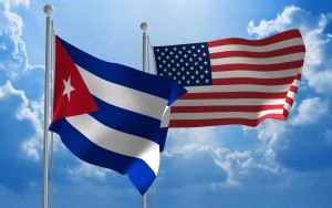 Cuba and United States flags flying together for diplomatic talks